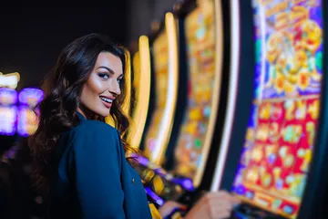 A close-up shot of golden coins falling around a spinning roulette wheel, representing immersive casino action at SZ777.