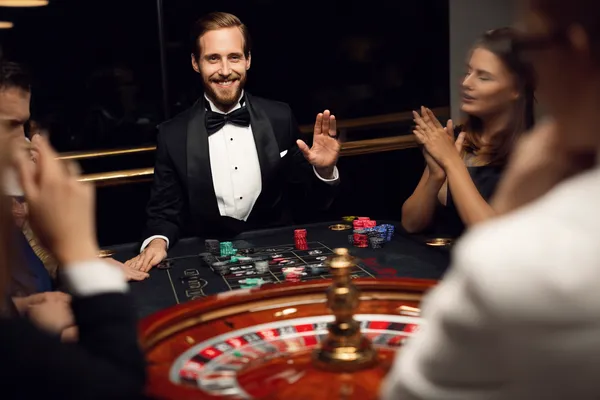 A confident dealer surrounded by casino chips inviting players to access their SZ777 account, reflecting quick and easy login options.